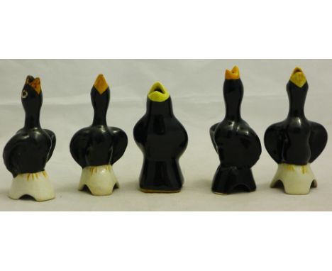 A collection of ceramic blackbird pie funnels