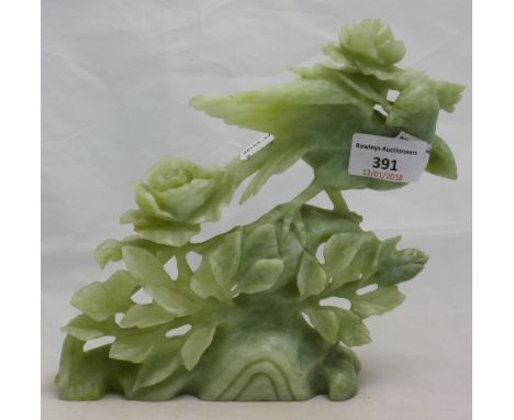 A jade carved model of a bird