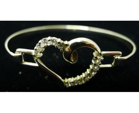 A silver heart bangle