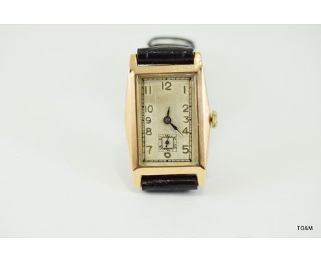 Deco Style tank watch wristwatch. 9ct gold tonneau. manual wind movement marked 15 jewels Swiss made. Glasgow import marks. c