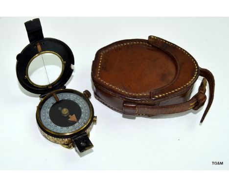 A Verners pattern Mk.VII Marching Compass by Aitchison of London in its leather carry case with belt loop