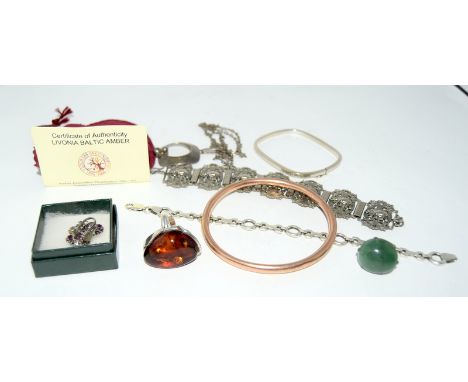 A gold ladies bangle with silver and mixed stone jewellery