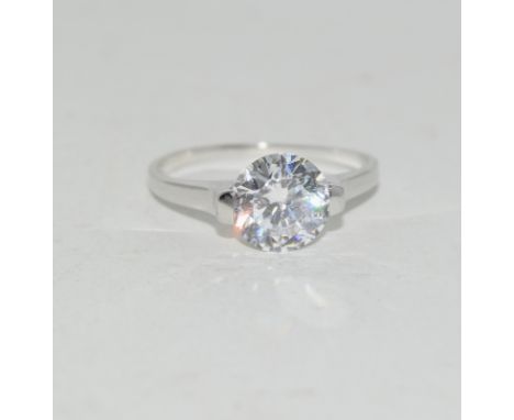 A CZ and silver engagement ring