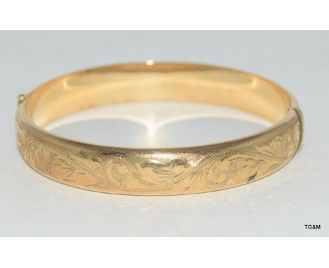 9ct gold ladies bangle with embossed decoration 6x5.5cm internal dia