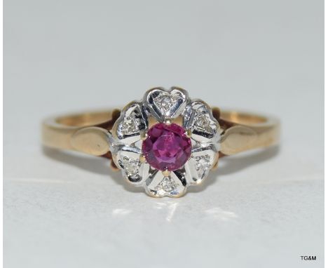 9ct gold ruby and diamond cluster ring. Size O