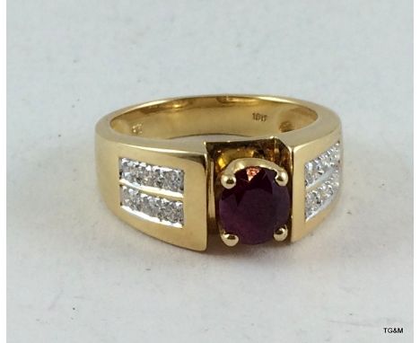 An 18ct gold diamond and ruby mans ring size W 12.8 grams approx 0.4ct diamond