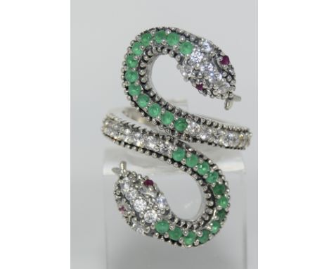 A silver snake ring set with semi precious stones