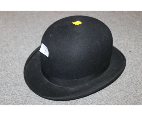 A VINTAGE BOWLER HAT