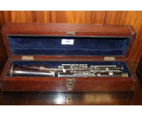 A CASED VINTAGE CLARINET BY BOOSEY AND CO OF LONDON