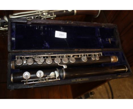 A CASED VINTAGE FLUTE BY RUDALL CARTE AND CO OF LONDON 