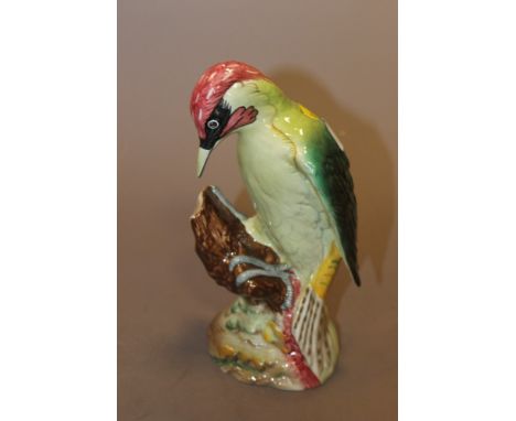 A LARGE BESWICK WOODPECKER FIGURE