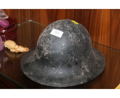 A VINTAGE STEEL TOMMY HELMET