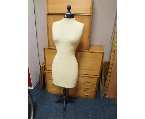 A VINTAGE DRESSMAKERS DUMMY ON STAND