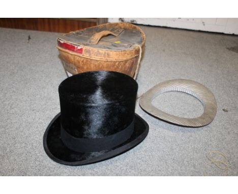 A VINTAGE LEATHER BOXED TOP HAT 
