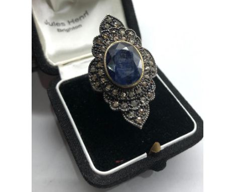 Large silver rose diamond and sapphire dress ring central blue stone measures approx 15mm by12mm with small rose diamonds aro