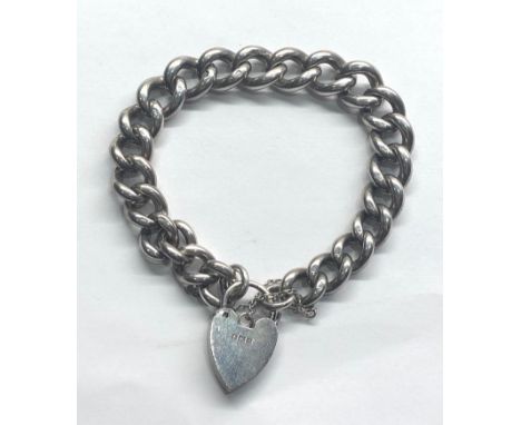 Vintage chunky silver charm bracelet weight 48g,&nbsp;the heart is hallmarked 1963, chain hallmarked with lion on every link