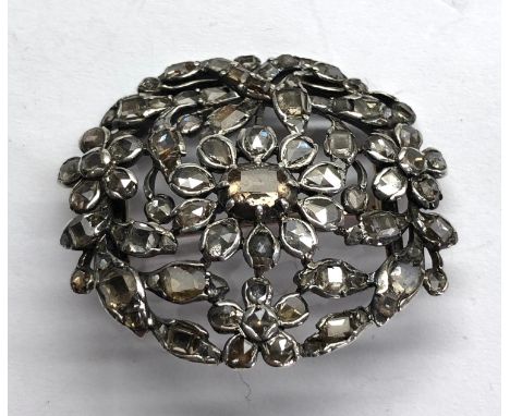 Antique rose diamond brooch set in silver and gold mounts measure approx 40mm by 35mm centre stone measures approx 6mm by 4mm