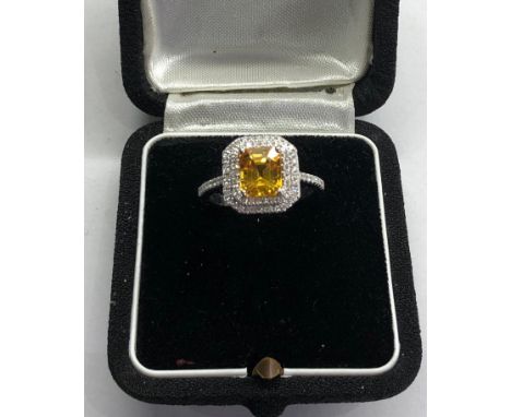 Fine 2.46ct yellow sapphire and diamond ring central yellow sapphire measures approx 8mm by 7mm with diamonds around with dia