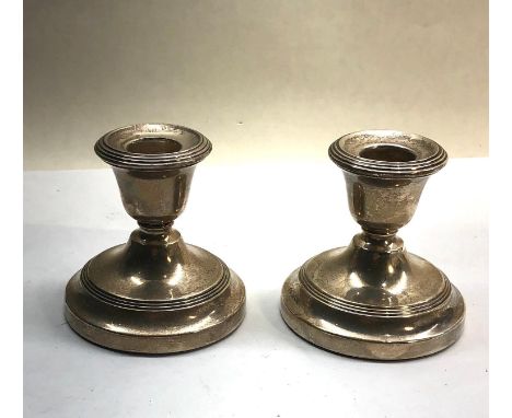 Pair of vintage 1950 Birmingham Silver squat candle sticks filled  Dimensions - 7.5cm(h) x 7.5cm(w) 