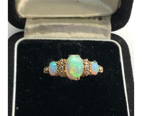 Antique 18ct diamond and opal ring central opal measures approx 8.5mm by 6mm marked 1922 and 18ct 