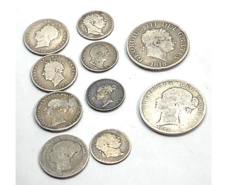 Collection of Georgian and victorian silver coins includes half crowns shillings and sixpences 