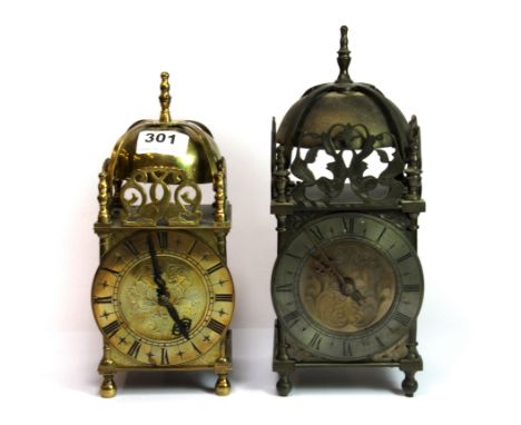 Two brass lantern clocks, tallest H. 28cm one with old electrical movement, the other with replacement battery movement.