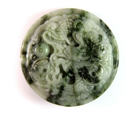 A Chinese carved jade/hardstone buckle. Dia. 5.8cm.