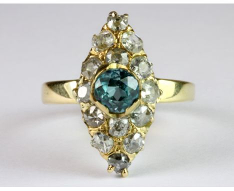 An early 18ct yellow gold (stamped 750) ring set with rose cut diamonds and a natural blue zircon (R.5).