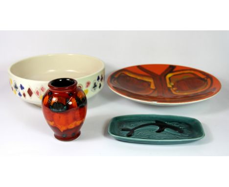 Four good pieces of Poole pottery including a bowl designed by John Waddington painted with playing cards suits, bowl dia. 23