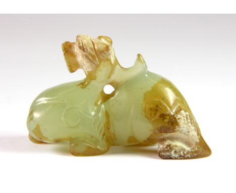 A Chinese carved archaic form jade figure of a dragon, 7 x 4 x 2.5cm.