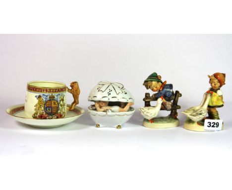 Two Goebel figures, a Paragon china commemorative cup and saucer and one other item.