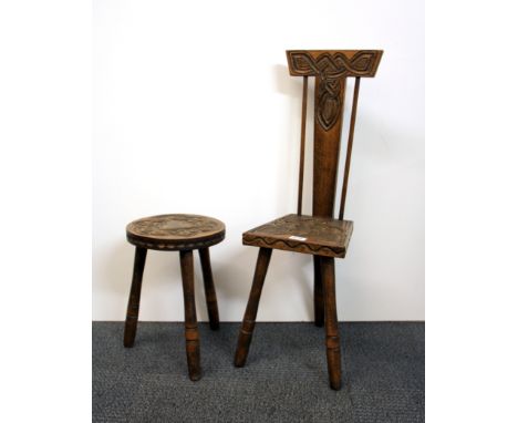 A Celtic design Arts  and Crafts carved oak chair and  stool, chair height 80cm.