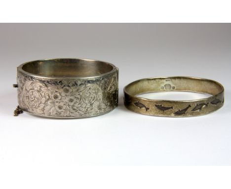 A hallmarked silver bangle together with a further sterling silver bangle.