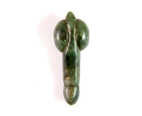 A Japanese carved jade erotic netsuke, L. 7cm.