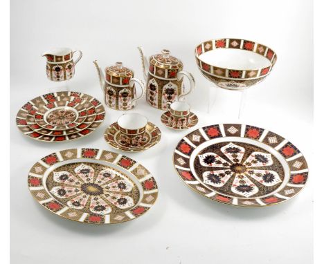 A Royal Crown Derby service, decorated in the 1128 Imari pattern and comprising two teapots, milk jug, a slop bowl, 12 6.5ins