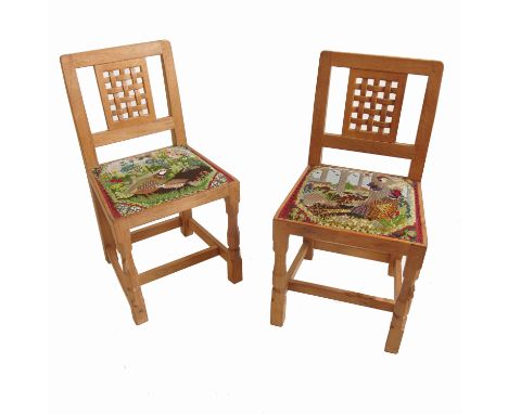 A set of eight Mouseman, Robert Thompson of Kilburn, oak chairs, with interwoven rectangular lattice panel backs and Bradley 