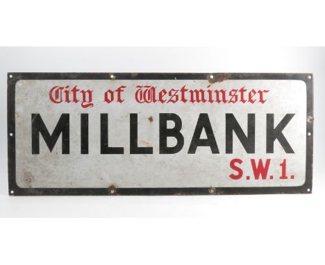 An enamel sign, City of Westminster Millbank S.W.1, 12ins x 30ins