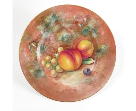 A Royal Worcester plate, hand painted with fruit to a mossy background by J Cook, diameter 8ins    Condition report:  Good co