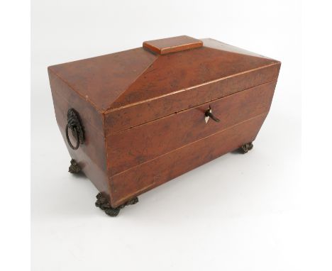 A 19th century sarcophagus shaped burr yew wood tea caddy, with two compartments and central mixing bowl, width 11.5ins