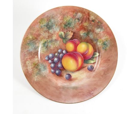 A Royal Worcester plate, hand painted with fruit to a mossy background by J Cook, diameter 10.75ins    Condition report:  Goo