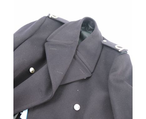 A dark blue forces great coat, with epilates and gilt buttons, together with a similar lighter blue great coat