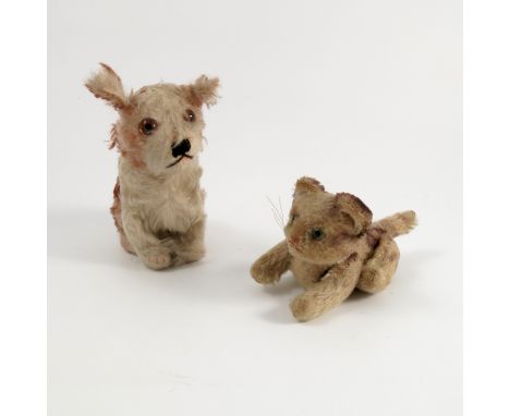 A Steiff model, of a plush dog, height 5.5ins, together with another of a plush cat, button missing, height 4ins