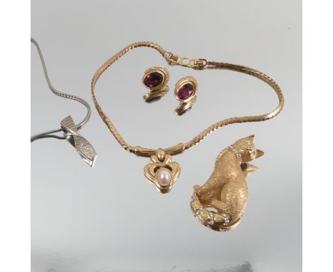 A Christian Dior simulated pearl pendant necklace, together with original card box, a Grosse Diamante set cat brooch, a Gross