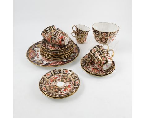 A Royal Crown Derby part tea service, decorated in the 2451 Imari pattern, comprising six cups, six saucers, six side plates 