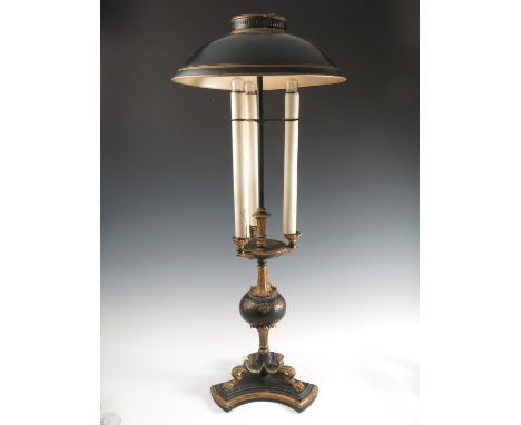 A table lamp, in the Italian style with three candle lights, below a circular tole ware shade, raised on a triform base, heig