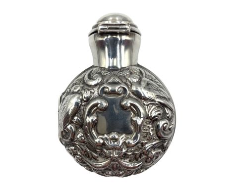 Late Victorian silver cased scent bottle, the hinged case chased with birds and scrolls, opening to reveal a green glass flas