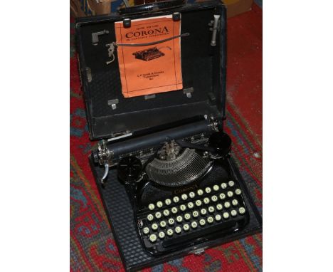 A cased Corona typewriter with original manual.