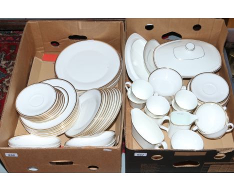 Two boxes of Royal Doulton china tea/dinner service decorated in the Gold Concord pattern including tea cups and saucers, mil