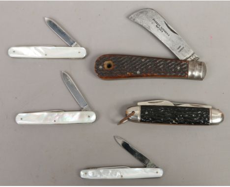 A Joseph Rodgers folding knife a multi blade pocket knife and three multi blade pocket knives with mother of pearl scales.