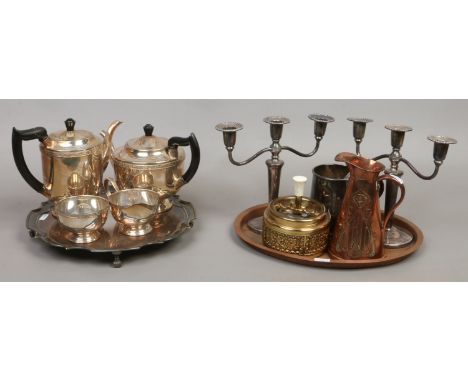 A group of decorative metalwares including a silver plated tea service on tray, an Art Nouveau copper jug, copper tray, brass